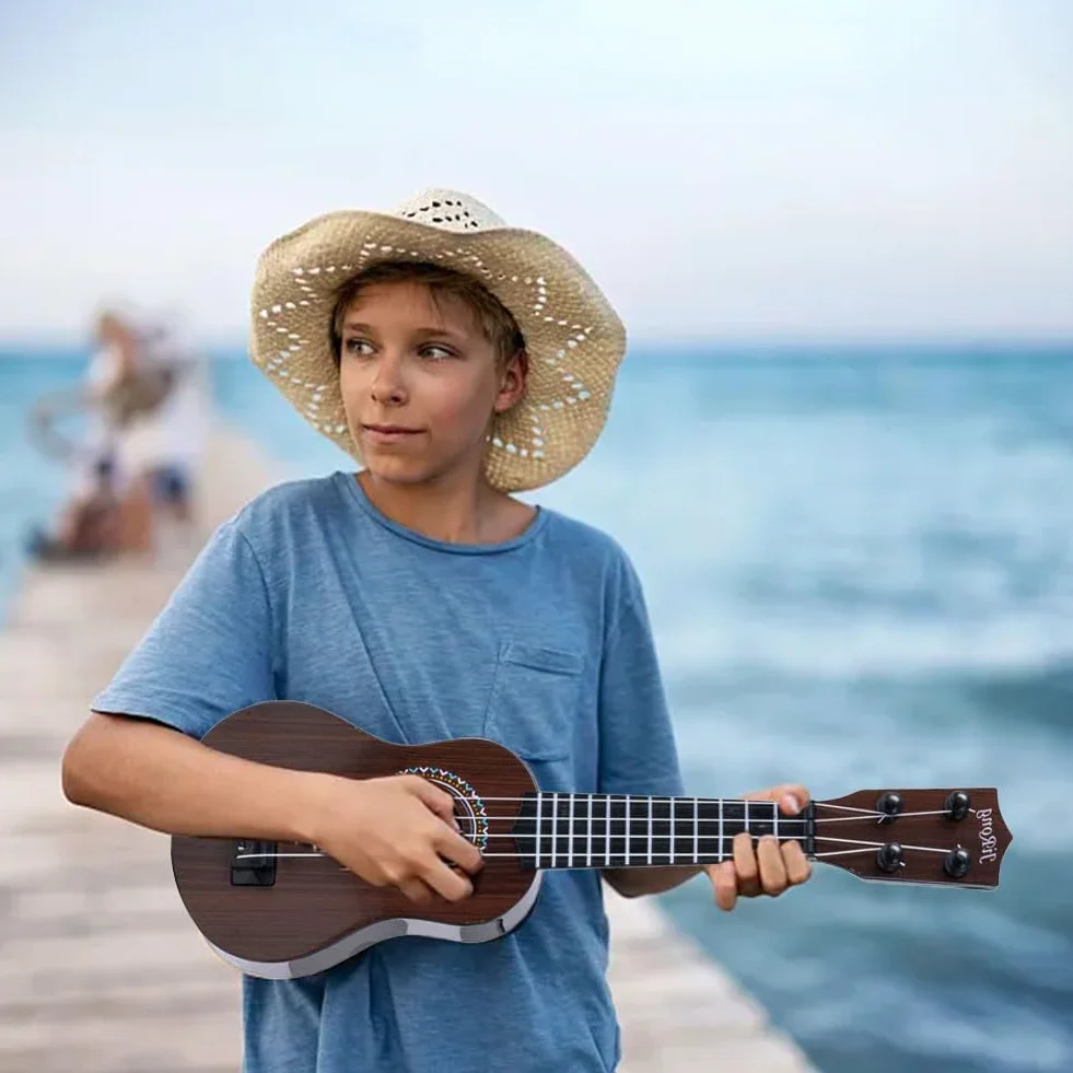 Mini Guitarra Ukelele de Juguete de 4 Cuerdas para Niños, Juguetes de Guitarra para niño pequeños con un simpático Dinosaurio, Ukelele para Niños como Instrumento Musical (A5)