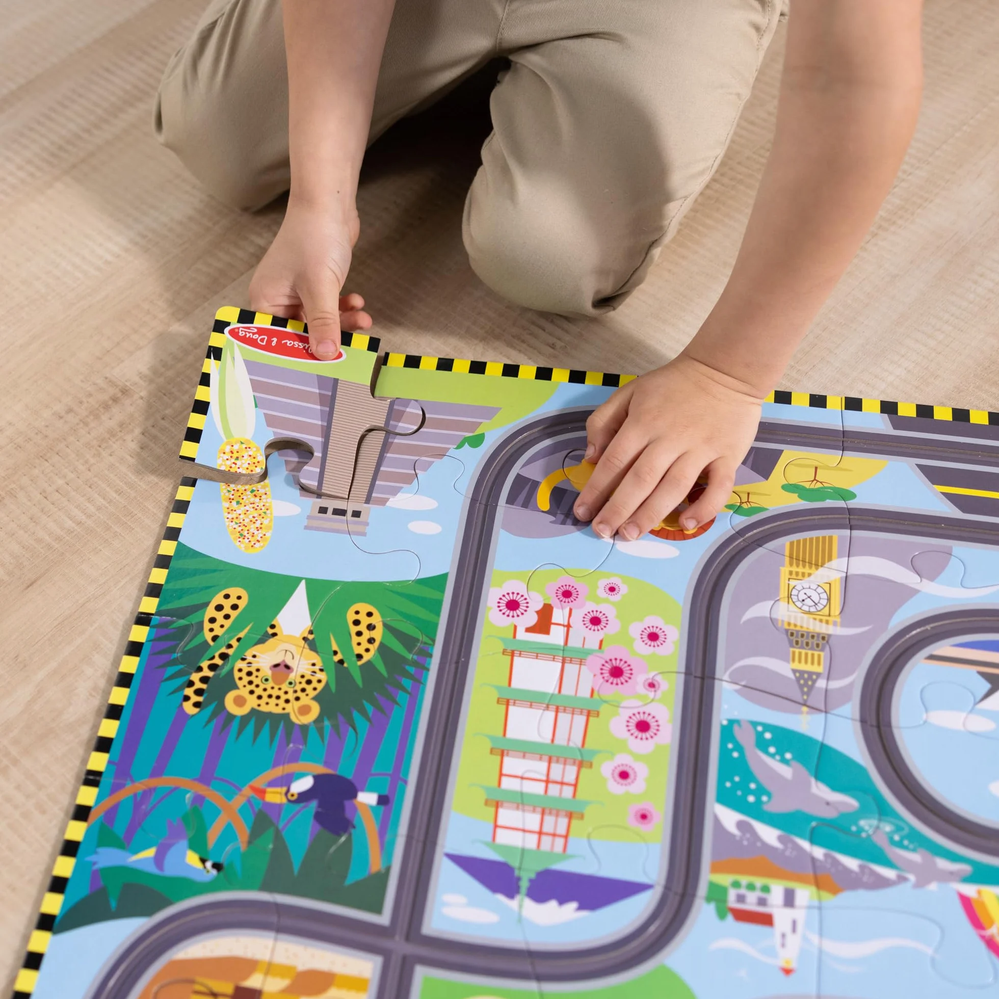 Melissa & Doug Puzzle de Piso de cartón Pistas de Carreras Alrededor del Mundo y vehículos de Cuerda – 48 Piezas, para niños y niñas a Partir de 3 años - Certificados FSC