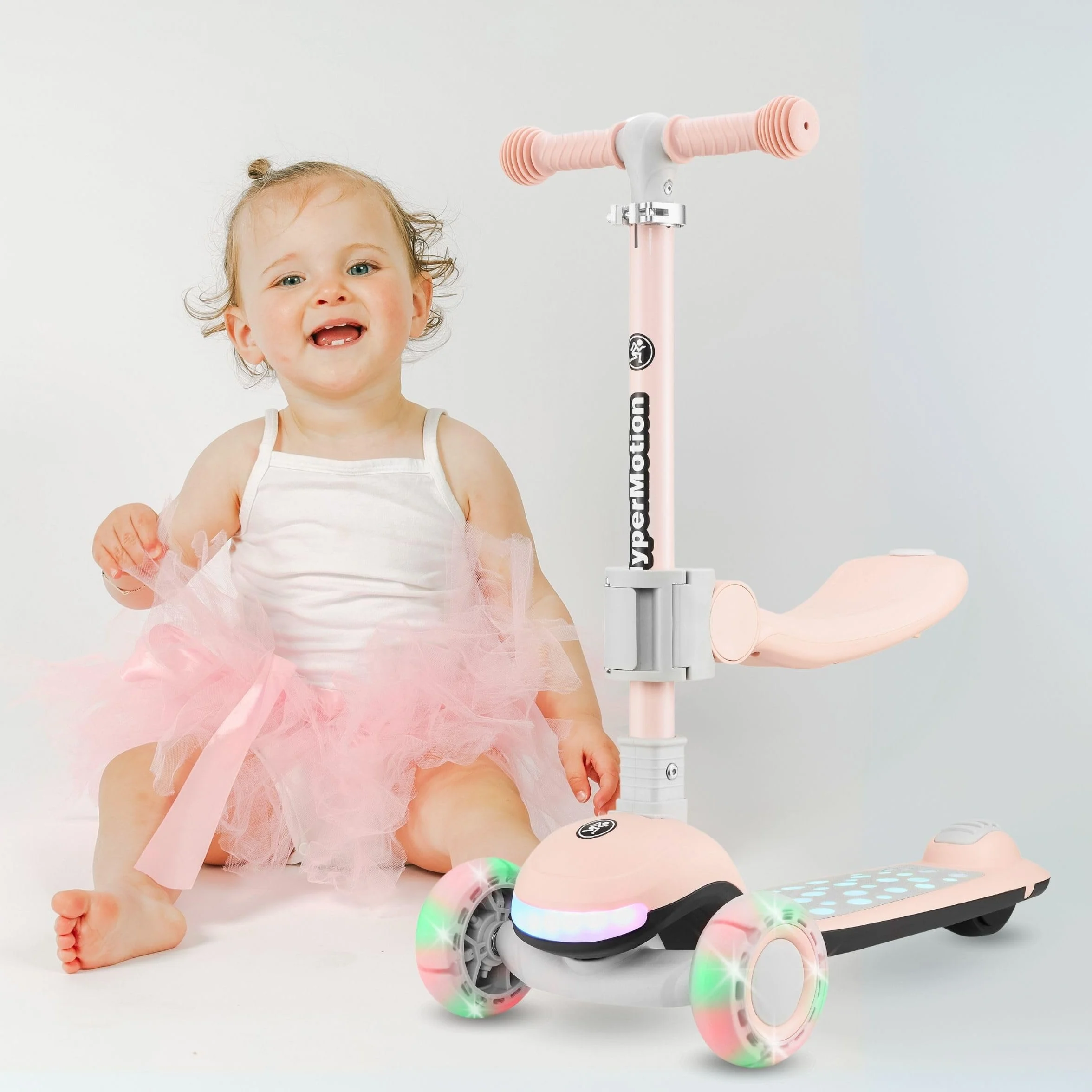 HyperMotion Patinete para niños con Luces LED 3 en 1 LUMI, Asiento Ajustable, Plegable, Ruedas de PU, Manillar T-Bar, hasta 50 kg, Desde 1 año, Uso Interior y Exterior (Rosa)